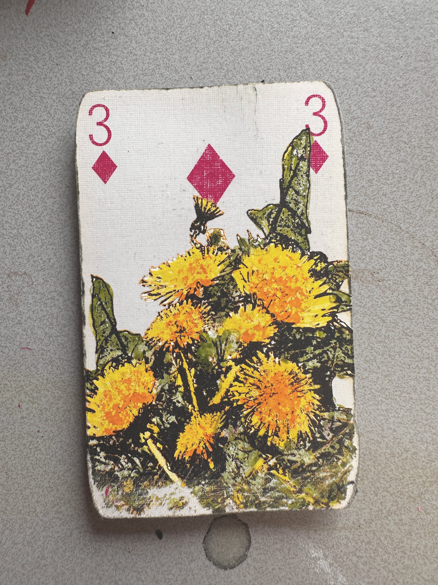The Best Hand original art playing card by Oli Fowler, three of diamonds hand screen-printed with a cluster of yellow dandelion flowers