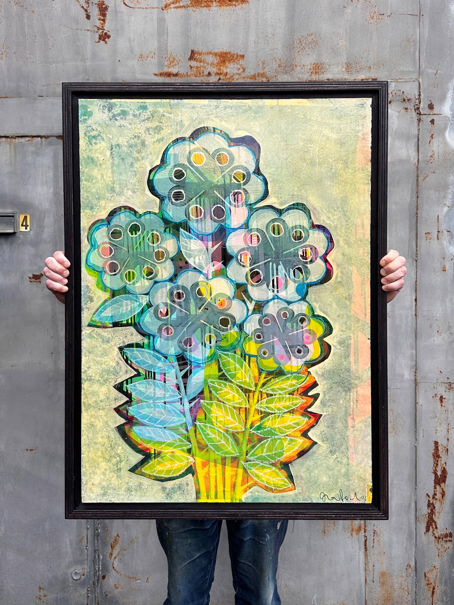 When It Snows original mixed media artwork by Oli Fowler, framed in stained birch, icy pastel blue and white pop flowers over a frosted pale background with warm neon yellow and orange leaves beneath