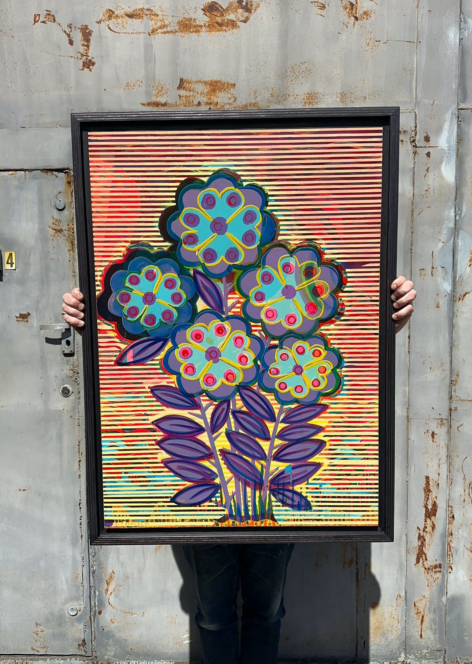 Change Re Arrange original mixed media artwork by Oli Fowler, framed in dark stained birch, blue and purple pop flowers with pink centres over a red, yellow and black striped background