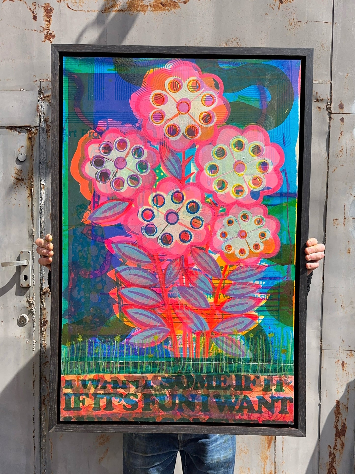 Snakes In The Grass original mixed media artwork by Oli Fowler, framed in oak clad float frame, pink and cream pop flowers over a blue-green collaged background with stencilled text reading If It's Fun I Want Some along the base