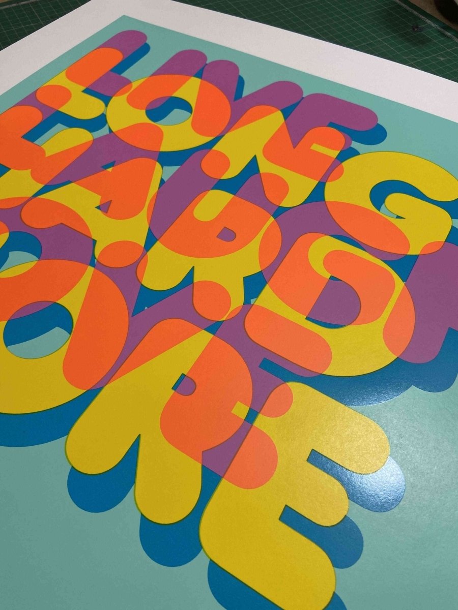 5-colour screenprint, turquoise pink orange yellow blue, bold overlapping 'Live Laugh Love' lettering on white paper