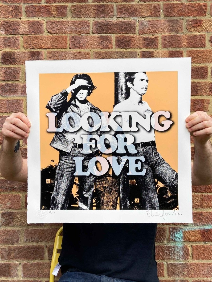 Looking For Love hand-pulled screenprint by Oli Fowler — two retro figures with bold groovy type on orange