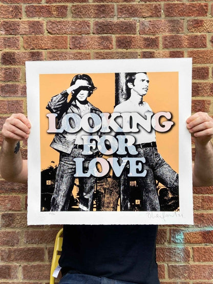 Looking For Love hand-pulled screenprint by Oli Fowler — two retro figures with bold groovy type on orange