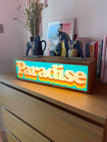 Paradise Light Box, hand-pulled screenprint by Oli Fowler, teal and orange retro typography in illuminated bamboo frame