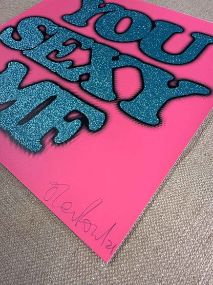 Hand-pulled glitter screenprint, turquoise and black on coral pink, bold 'You Sexy MF' text, edition of 100